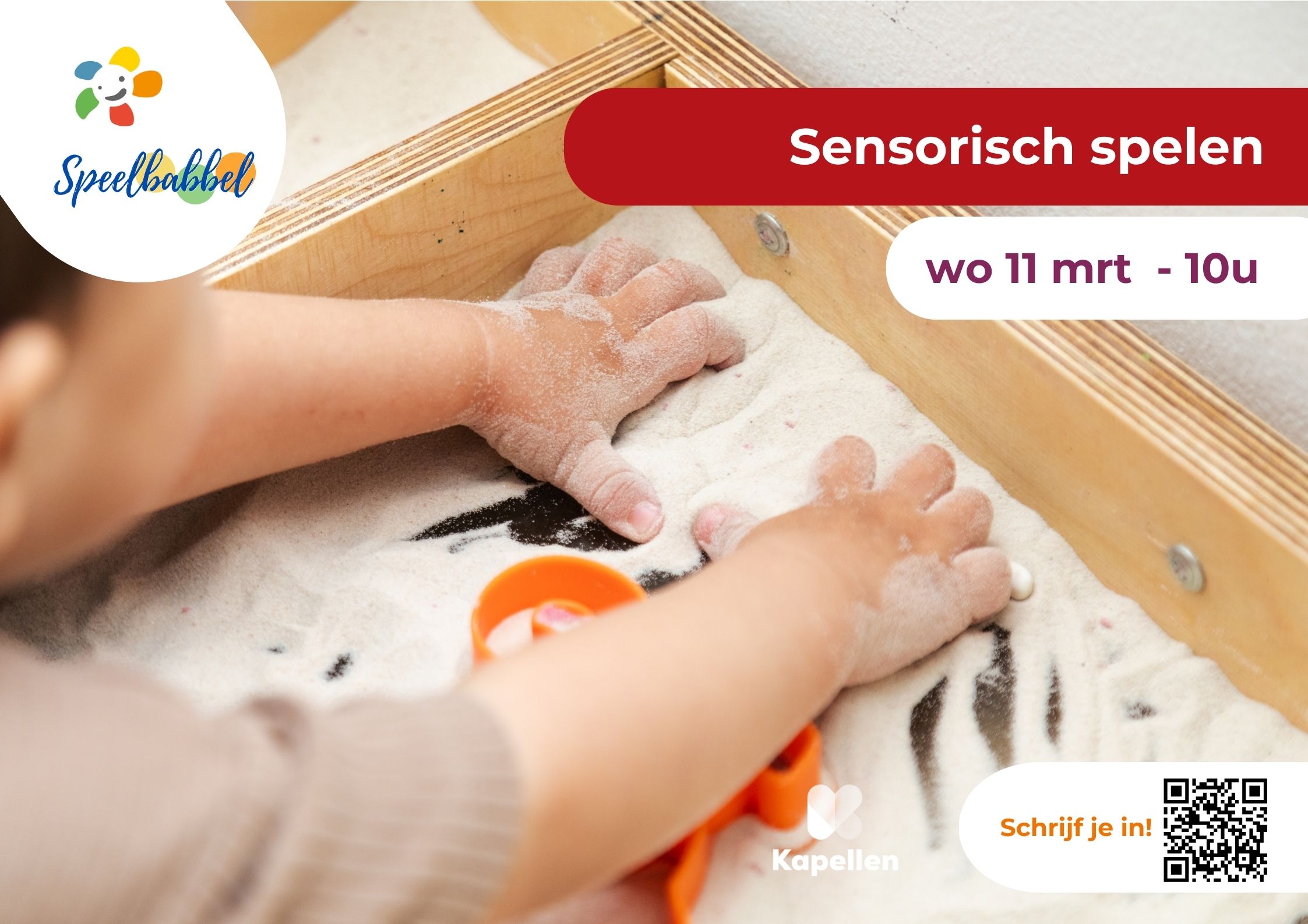 handen van een peuter in een bakje met fijn zand